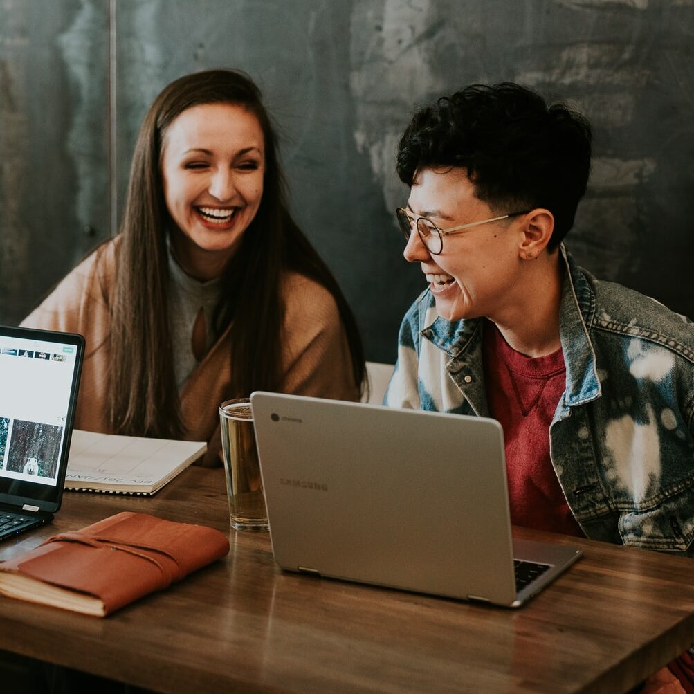 executivefunctioncoaching-front01 Photo of two students studying and looking at a laptop